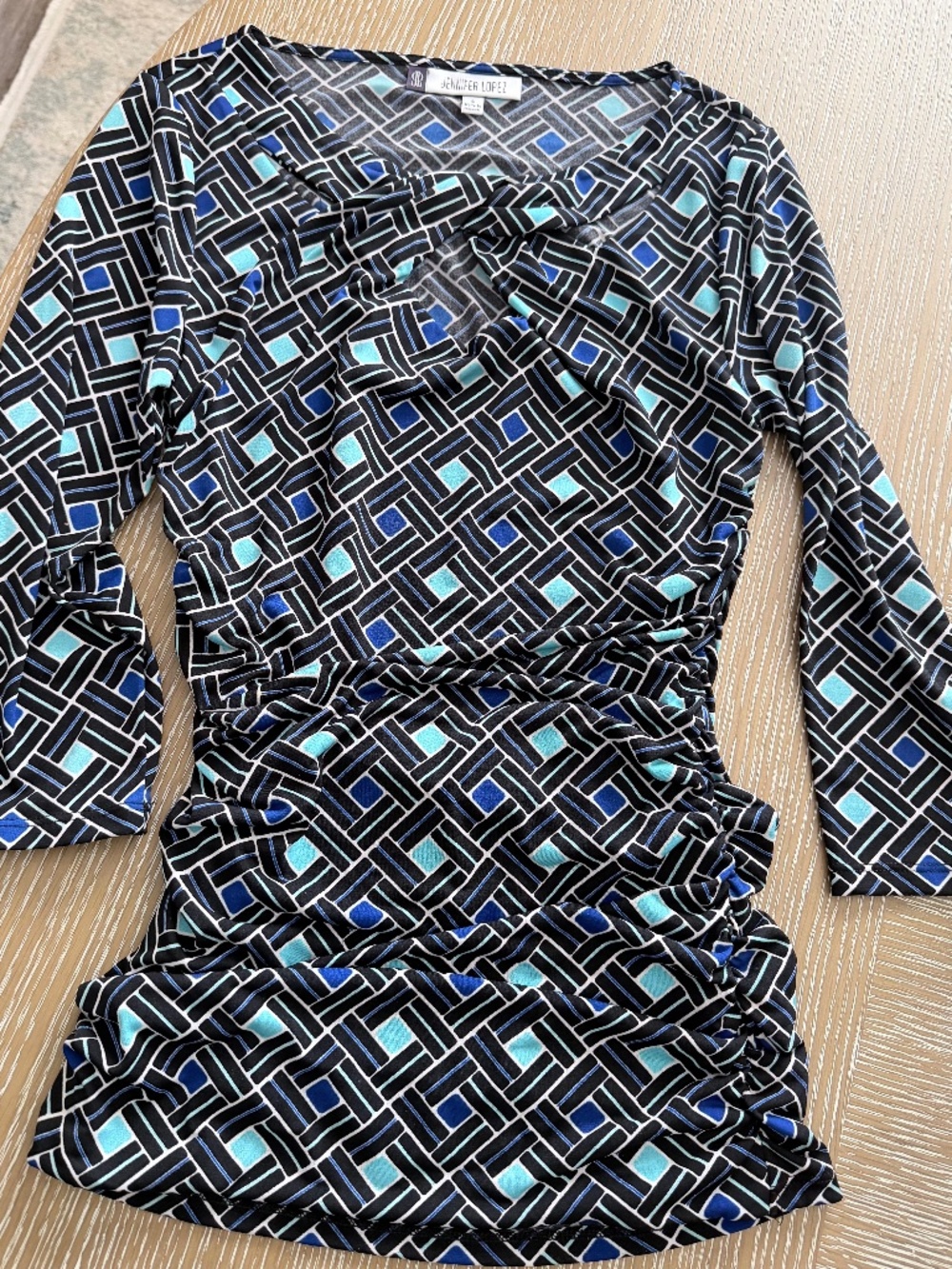 Jennifer Lopez “Ruched Sheath” blouse